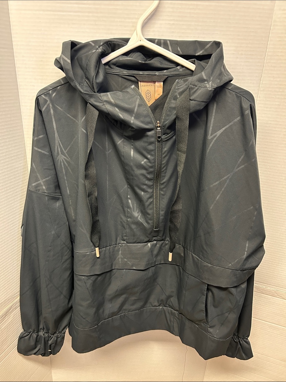 INDYGENA Black Hooded Pullover anorak Windbreaker with Subtle Pattern